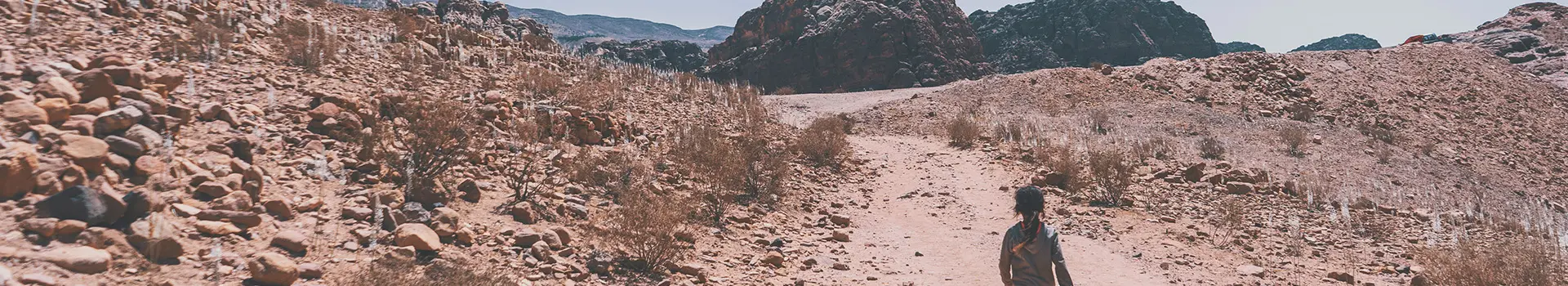 A little girl walking in the desert of Petra
